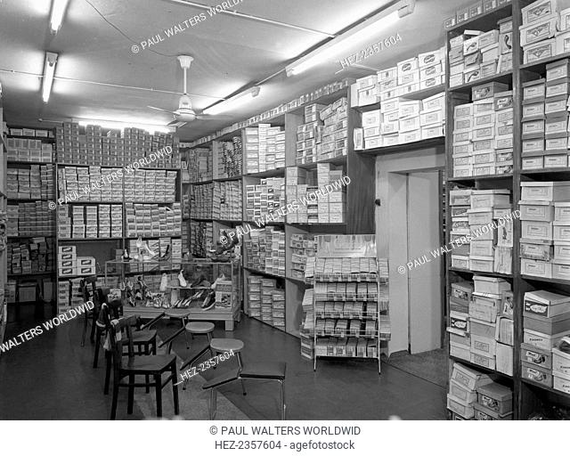 Sports shop interior, Sheffield, South Yorkshire, 1961. The interior of Sugg Sports in central Sheffield, showing the shoe department with a comprehensive range...