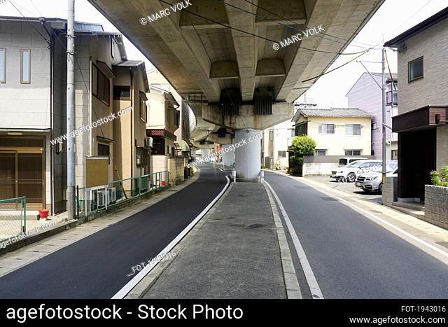 Overpass and street splitting urban neighborhood, Kyoto, Japan