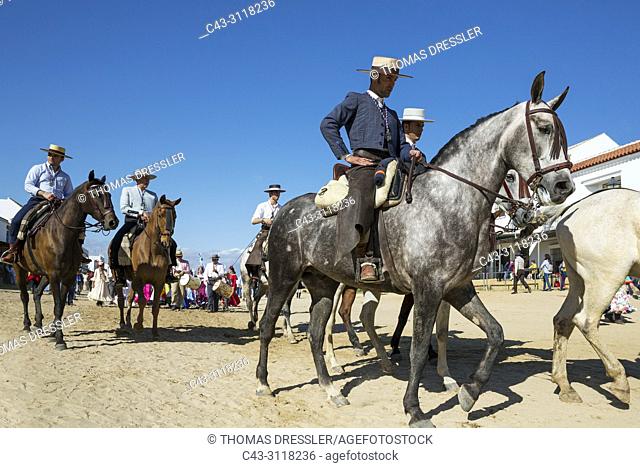 Dressed up horsemen during the annual Pentecost pilgrimage of El Rocio. Huelva province, Andalusia, Spain