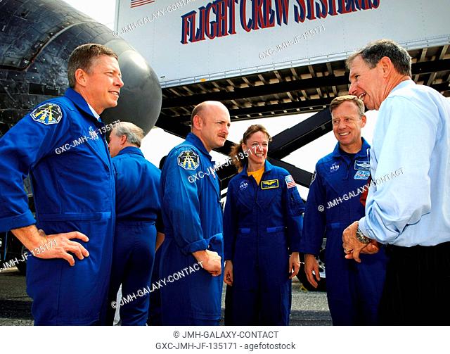 Dr. Michael Griffin (right), NASA Administrator, talks with STS-121 crew members (L to R) Michael E. Fossum, mission specialist; Mark E