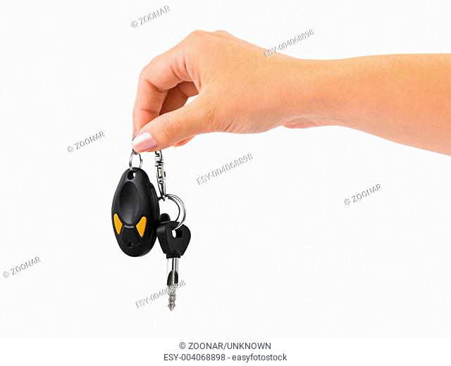 Hand and car key