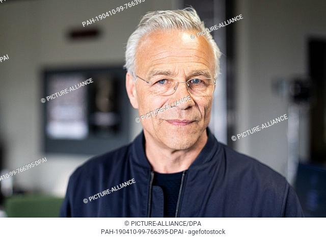 10 April 2019, North Rhine-Westphalia, Köln: Klaus J. Behrendt (as Commissioner Max Ballauf), actor, stands in the new commissariat during the shooting of the...