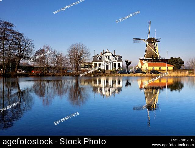 Windmill De Lelie in Rotterdam on the shore of lake Kralingse Plas