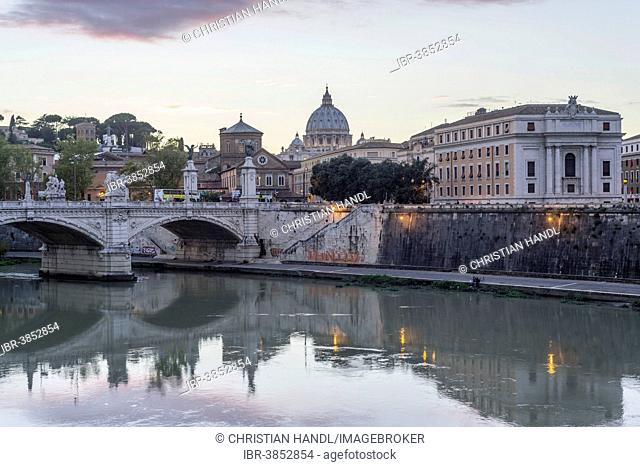 View of St. Peter's Basilica seen from Ponte Sant'Angelo bridge, the Tiber River in the foreground, Rome, Lazio region, Italy