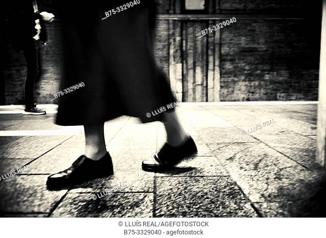 Closeup of the feet of an old lady walking. Bucharest, Romania, Europe