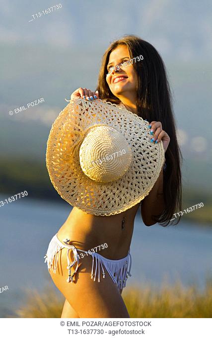 Happy in the sunset young woman