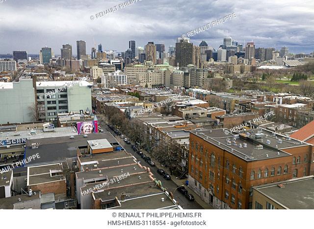 Canada, Quebec province, Montreal, downtown and its skyscrapers in aerial view, foreground buildings and homes in the Plateau Mont Royal neighborhood