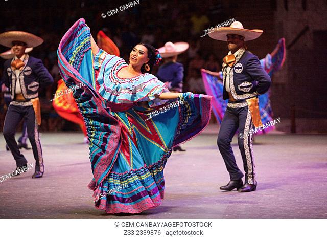 Dancers during a performance of ""Mexico Espectacular""' with traditional dress at the stage, Xcaret, Playa del Carmen, Riviera Maya, Yucatan Province, Mexico