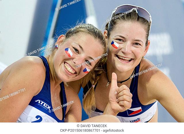 From left Czech volleyball players Eliska Galova and Karolina Rehackova smile and pose for photo during the Women's beach volleyball Round of 16 match Czech...