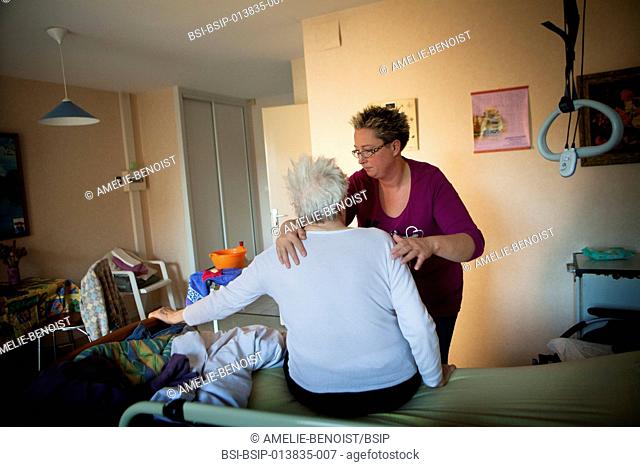 Reportage on a community nurse making home visits in a rural area. She is treating a patient in a nursing home