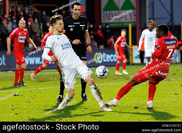 OHL's Mathieu Maertens and Kortrijk's Dylan Mbayo fight for the ball during a soccer match between KV Kortrijk and OHL Oud-Heverlee-Leuven