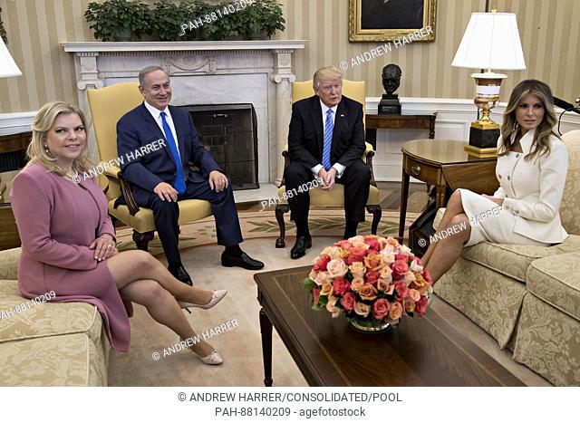 U.S. First Lady Melania Trump, from right, U.S. President Donald Trump, Benjamin Netanyahu, Israel's prime minister, and his wife Sara Netanyahu sit in the Oval...