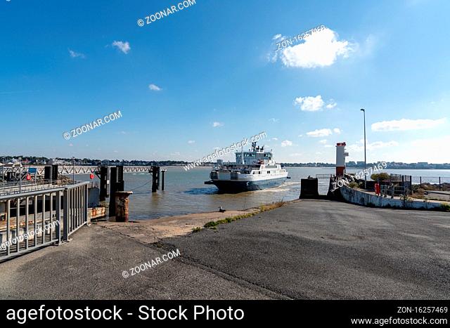 Royan, Charente-Maritime / France - 17 October 2020: the Gironde ferry arrives at the port of Royan to load and transfer vehicles