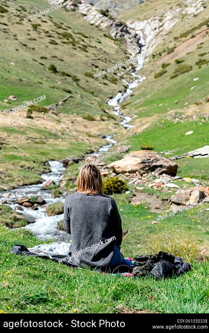 Young Woman whit mask in Montaup river in Canillo, Andorra in spring