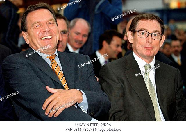 (dpa) - German Chancellor Gerhard Schroeder (L) and Airbus President Noel Forgeard are pictured at the inauguration of the first hall for the production of the...