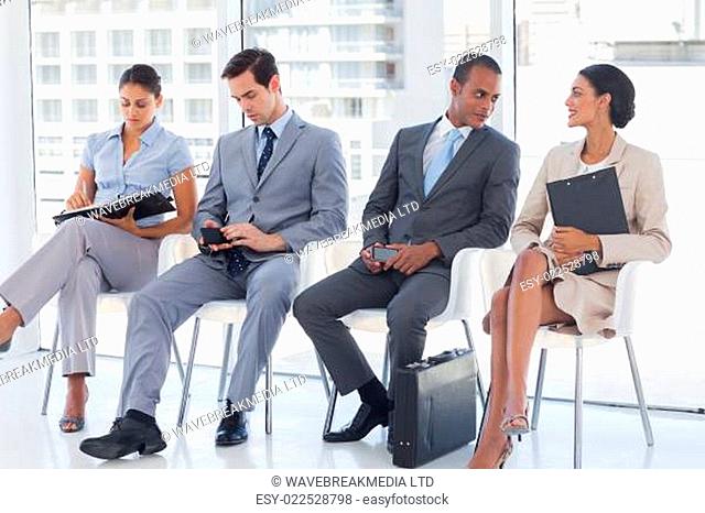 Business people sitting together in a meeting room