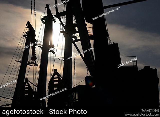 RUSSIA, VLADIVOSTOK - DECEMBER 14, 2023: Cranes are seen at the Vladivostok Sea Fishing Port on Russia's Pacific coast, The port offers services for...