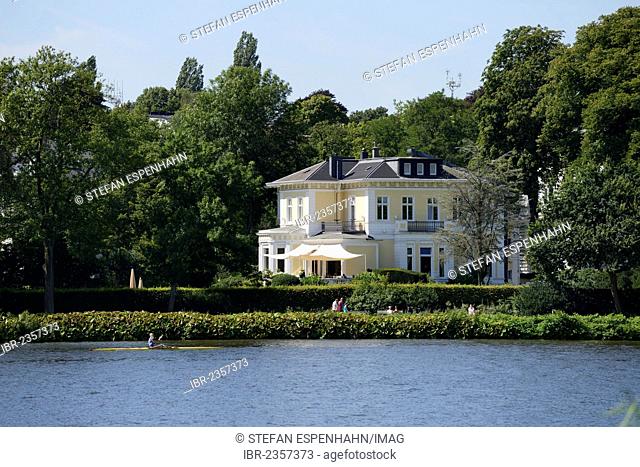 Mansion with a rowing boat at front on the Aussenalster or Outer Alster Lake