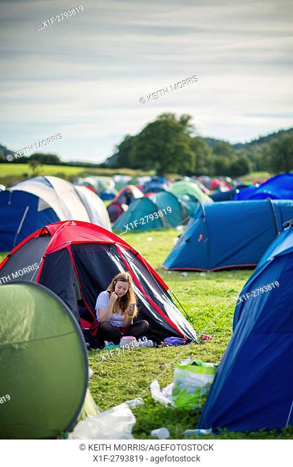 Young teenage girls enjoying themselves on the youth campsite (Maes B) at The National Eisteddfod of Wales , held near Meifod village in Powys, mid Wales