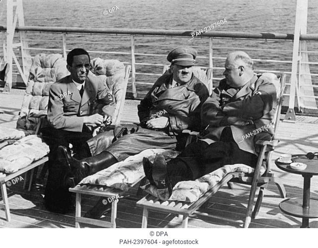 (L-r) Reich Propaganda Minister Joseph Goebbels, Adolf Hitler, and Reich Governor Röver on the deck of a ship (undated). - /Germany