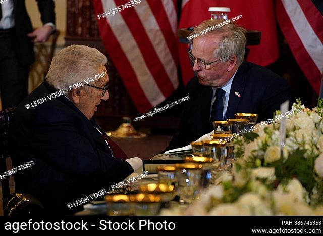 Former United States Secretary of State Henry A. Kissinger converses with Ambassador of France to the United States Philippe Etienne prior to a luncheon hosted...