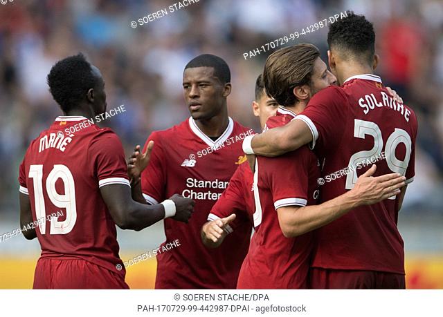 Liverpool's Georginio Wijnaldum (C) celebrates with teammates after giving his side a 2:0 lead during the international club friendly soccer match between...