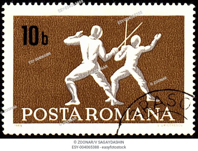 ROMANIA - CIRCA 1969: A post stamp printed in Romania shows fencing