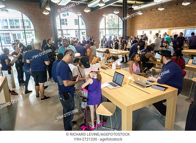Apple enthusiasts descend on Williamsburg, Brooklyn in New York for the grand opening of Apple's first store in Brooklyn