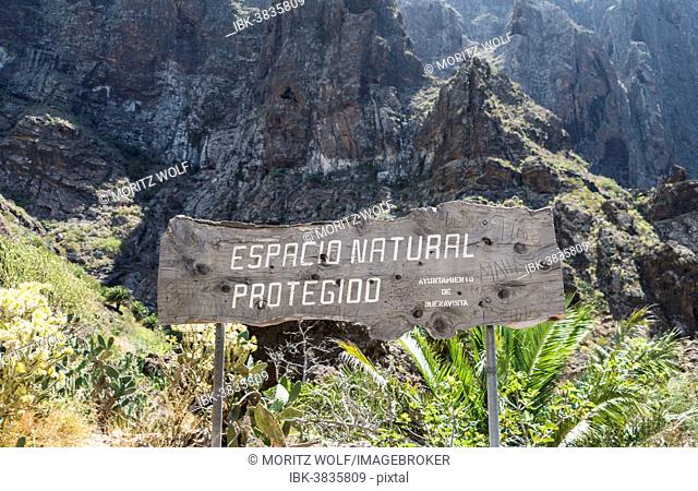 Sign &quot;Espacio natural protegido&quot; spanish for Nature Conservation Zone, Masca Gorge, Tenerife, Canary Islands, Spain