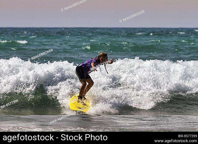 Surf rider, surfer on a wave at the beach, surf school, back light, surf spot Biarritz, Basque coast, Atlantic Ocean, Aquitaine