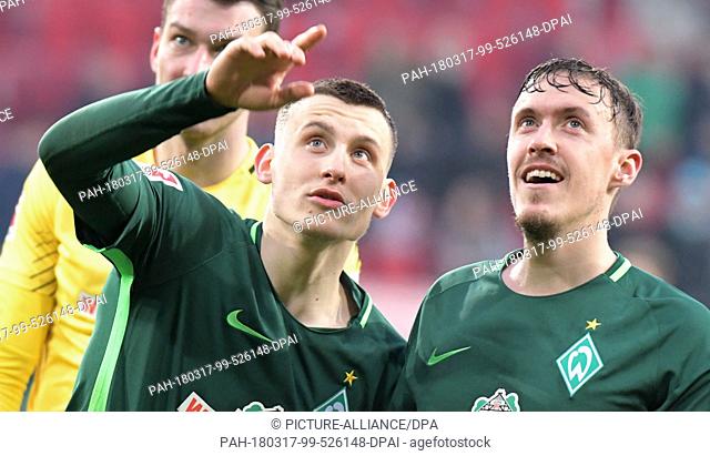 17 March 2018, Germany, Augsburg. Football Bundesliga, FC Augsburg vs Werder Bremen at the WWK-Arena. Maximilian Eggestein (l) and Max Kruse of Bremen look at...