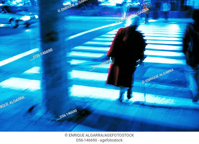 Elderly woman on pedestrian crossing