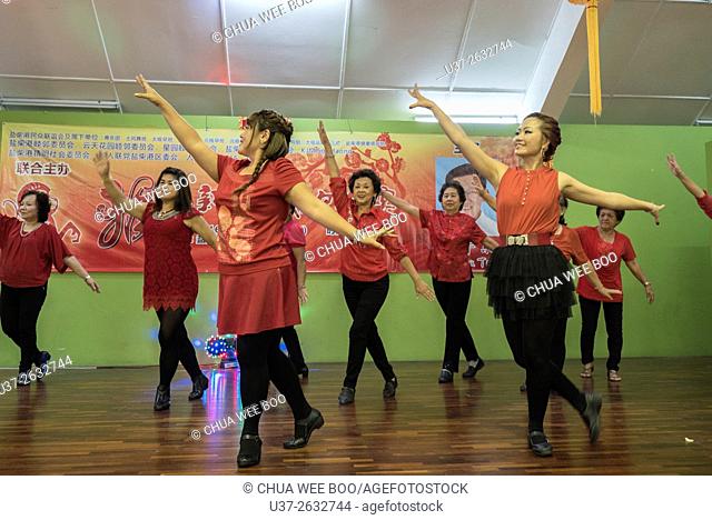 Folk dance for the Chinese New Year celebration dinner at Sungai Maong Community Hall, Kuching, Sarawak, Malaysia