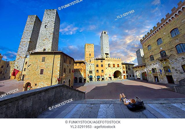 The Piazza Duomo (Cathedral Square) of San Gimignano with its medieval towers built as defensive towers and also to show the families wealth by the height of...