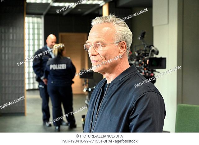 10 April 2019, North Rhine-Westphalia, Köln: Actor Klaus J. Behrendt as Commissioner Max Ballauf stands in the new commissariat during the shooting of the new...