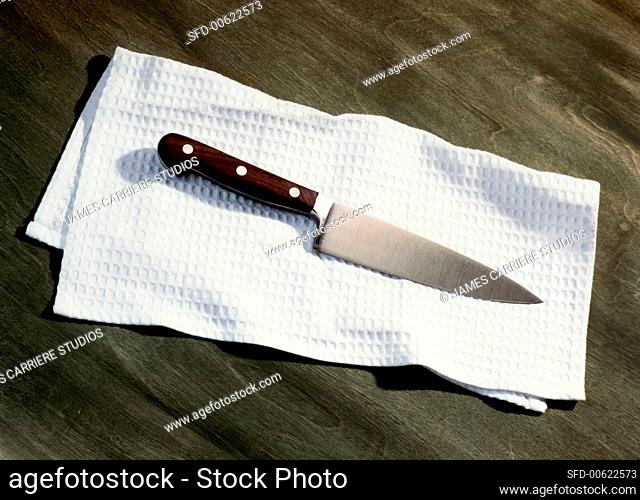 Chef's Knife on a Kitchen Towel
