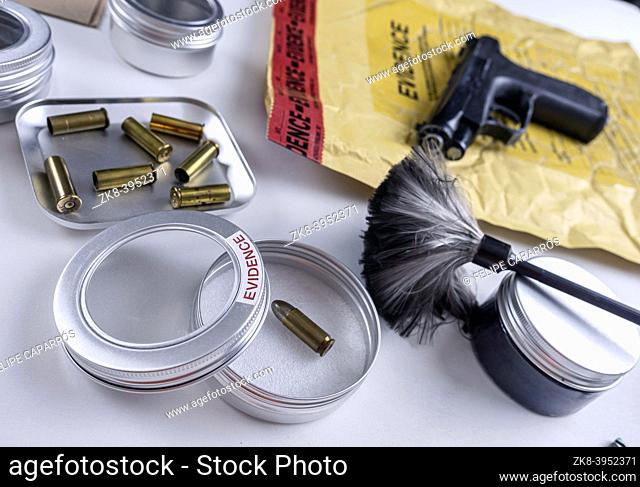 Bullet cap along with a gun in ballistic laboratory, conceptual image