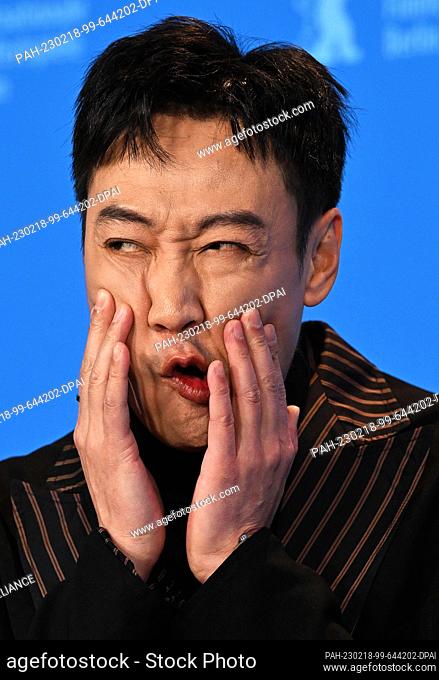 18 February 2023, Berlin: Xin Baiqing, actor, stands in front of the photo wall during the photo session for the film ""Bai Ta Zhi Guang"" (The Shadowless...