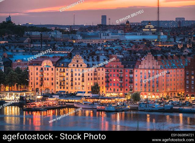 Stockholm, Sweden. Skyline View Of Residential Area Houses In Norr Malarstrand Street, Kungsholmen Island. Scenic View In Sunset Twilight Dusk Lights