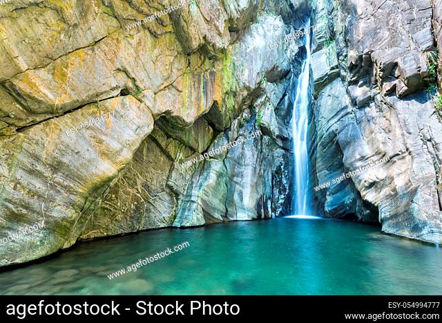 rock, cascade and pond water, beautiful natural scene in summer