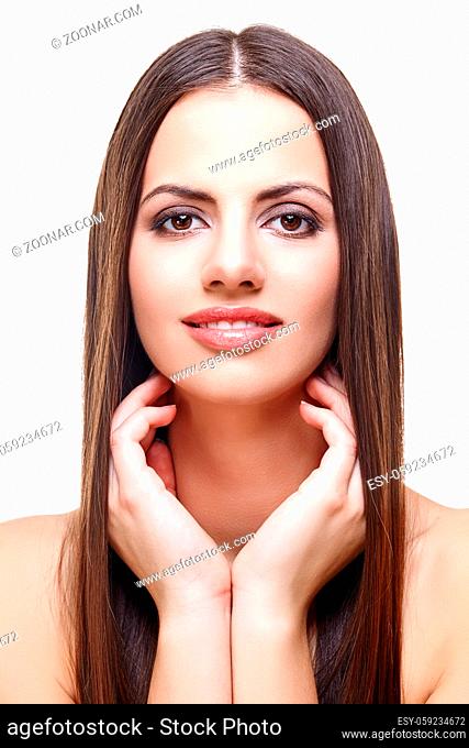 beautiful young woman with long healthy dark hair. beauty shot isolated on white background. copy space
