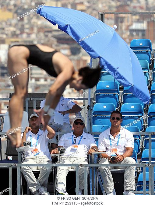 An unidentified diver is observed by referees during the Women's 10m platform diving preliminaries of the 15th FINA Swimming World Championships at Montjuic...
