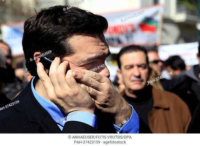 Alexis Tsipras of the Coalition of the Radical Left - Unitary Social Front (SYRIZA) talks on the phone during a general strike in Athens, Greece