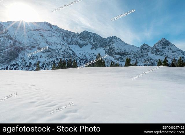 Winter landscape with the Austrian Alps with snow-capped peaks and a snowy valley, on a sunny day in December, in Ehrwald, Austria