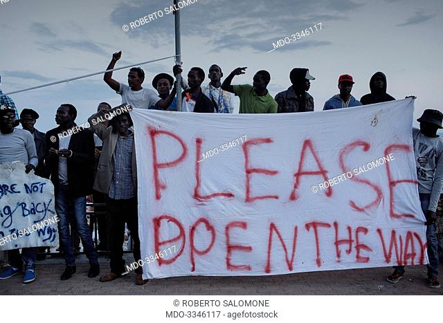 Dozens of African migrants, standing between France and Italy since many days, protesting againt the order given by the French government to close the borders...