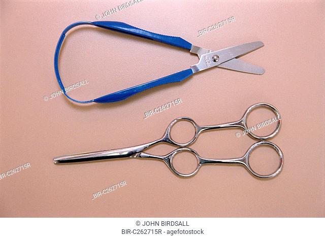 Close up of self opening scissors and dual control training scissors