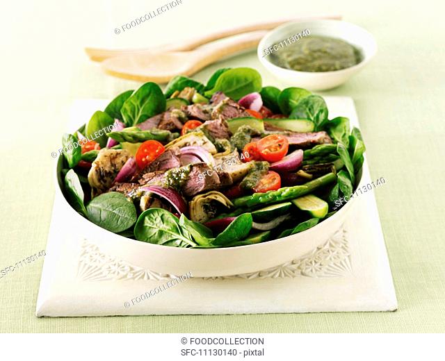 Lamb, cherry tomato and lamb's lettuce salad with a green dressing