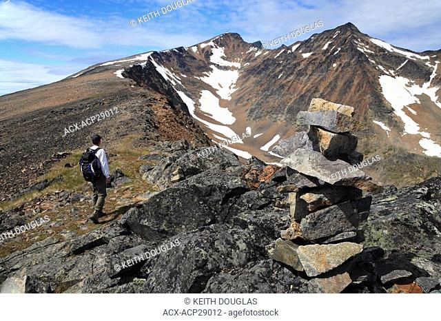 Hiker on trail up to peak of Hudson Bay Mountain, Smithers, British Columbia