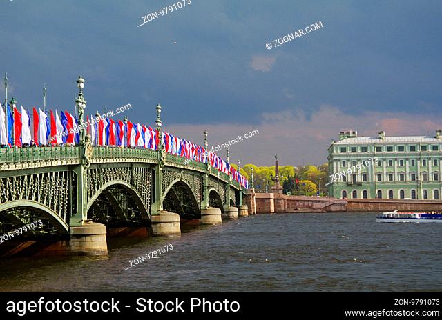 SAINT PETERSBURG, RUSSIA - MAY10, 2014: the Bascule Trinity Bridge Troitsky bridge across the Neva river with tricolor flags