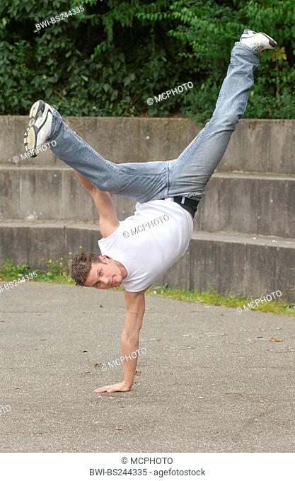 man doing breakdance, Germany, Vaihingen/Enz